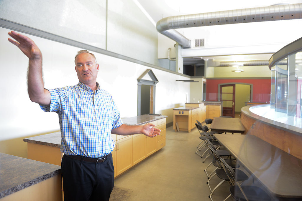Mike Reynolds, the new director of the Goodwill Excel Center, gives a tour of a new classroom